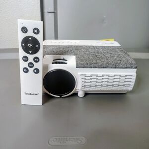 Brookstone White and Gray Portable Projector with Remote